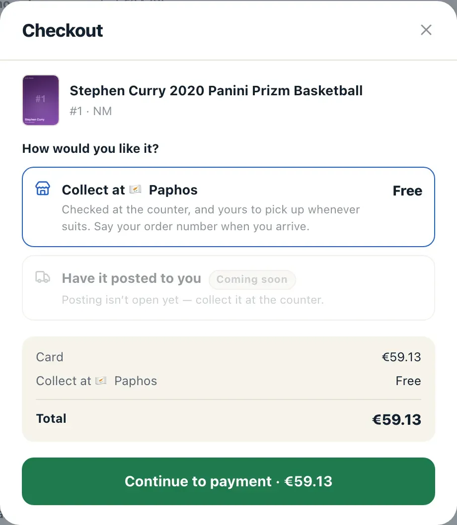 Checkout on a card: collection at the Paphos counter, priced Free, and the total that follows from it. Having the card posted to your address is shown disabled rather than promised — that route is not open yet.